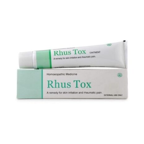 Homoeopathic medicine tube and box labeled "Rhus Tox," designed for alleviating skin irritation and rheumatic pain.