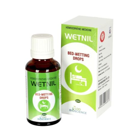 A bottle of Wetnil homoeopathic medicine for bed-wetting, alongside its packaging, showcasing the product name and usage instructions.