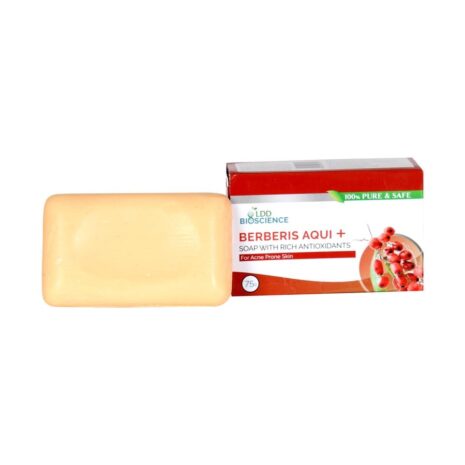 A bar of Berberis Aqui soap next to its packaging, designed for acne-prone skin and enriched with antioxidants.