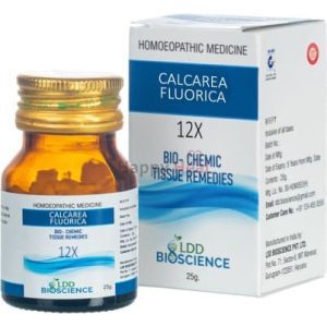 A 25g bottle of Calcare Fluorica 12X homeopathic medicine beside its packaging, labeled as bio-chemic tissue remedies.