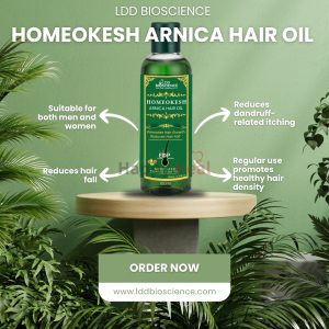 A bottle of Homeokesh Arnica Hair Oil on a wooden table surrounded by green plants, highlighting its benefits for hair growth and health.
