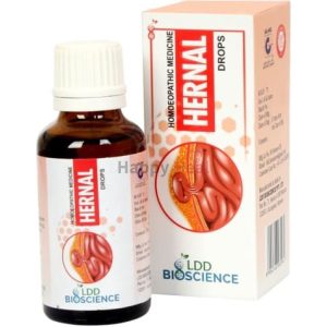 A bottle of Hernal homeopathic medicine drops alongside its packaging, featuring an illustration of the human digestive system.