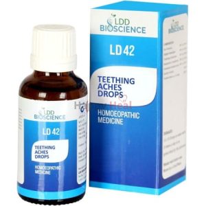 A bottle of homoeopathic teething aches drops labeled LD42 alongside its blue packaging.
