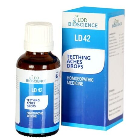 A bottle of homoeopathic teething aches drops labeled LD42 alongside its blue packaging.