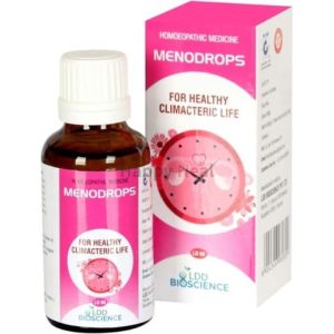 A bottle of Menodrops homeopathic medicine with a pink and white packaging, designed for healthy climacteric life.