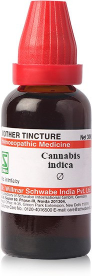 Bottle of Cannabis Indica homeopathic medicine with a red dropper cap and label detailing its contents and manufacturer.