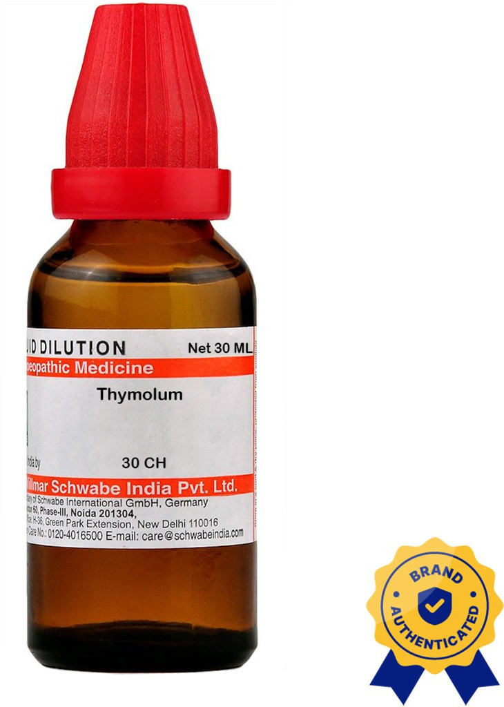 A brown glass bottle containing Thymolum homeopathic medicine, featuring a red cap and an authenticity seal, with a label displaying dosage and brand information.