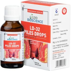 A bottle of LD-32 Piles Drops alongside its packaging, designed for treating internal and external hemorrhoids, featuring an illustration of the human digestive system.