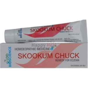 Tube of Skookum Chuck homeopathic medicine for treating eczema, displayed alongside its packaging.