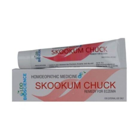 Tube of Skookum Chuck homeopathic medicine for treating eczema, displayed alongside its packaging.