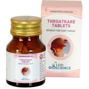 Homeopathic remedy for sore throat in a bottle with packaging.