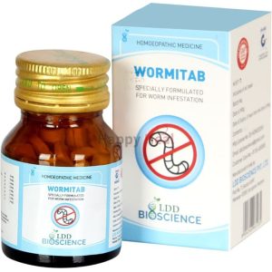 Bottle of Wormitab homeopathic medicine alongside its packaging, designed to treat worm infestations.