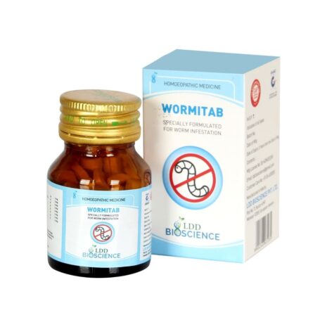 Bottle of Wormitab homeopathic medicine alongside its packaging, designed to treat worm infestations.