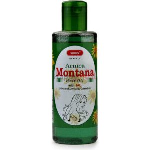 : A bottle of Sunny Herbs Arnica Montana Hair Oil with natural ingredients, featuring a green design and an illustration of a woman with flowing hair.