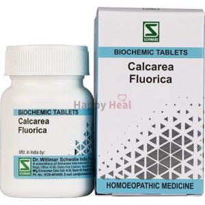 A container of Calcarea Fluorica biochemic tablets alongside its packaging, labeled as homeopathic medicine.