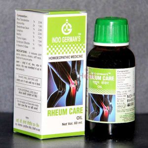Indo German's Rheum Care Oil:::A 60 ml bottle of homoeopathic medicine designed to relieve joint pain, displayed alongside its packaging detailing ingredients and usage instructions.