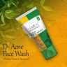 Aloe vera, neem, and turmeric face wash tube on a vibrant background with natural elements, promoting clear skin.