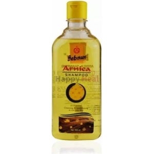 A bottle of Sebsun Arnica Shampoo with a yellow cap, featuring a label that highlights its herbal ingredients and benefits for hair care.